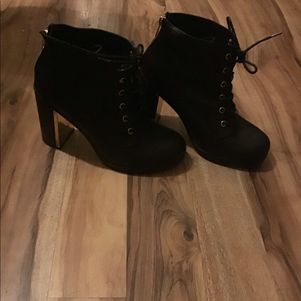 Women’s Torrid Zip-Up/Tie Boots with Heel.